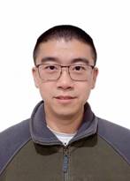 A person wearing glasses and a jacketDescription automatically generated with low confidence